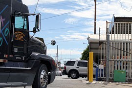 A semi truck waits to cross the United States-Mexico border at San Luis, Ariz., in this file photo. Despite a new pact opening the border to trucks, few Mexican companies, and no U.S. firms, have taken advantage of the deal.