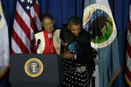 President Barack Obama hugs Mary Black Eagle who with her husband, Sonny Black Eagle, 