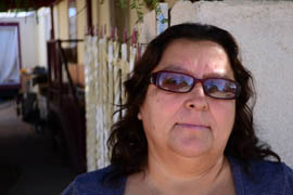 Leandra Rosales stands outside of her trailer home in the Yuma County community of Somerton. Rosales said she can’t work because of high blood pressure and heart problems caused by diabetes. She said she gets health care in San Luis Río Colorado, Sonora, Mexico, once a month because she doesn’t have health insurance. Her son and daughter also have diabetes.