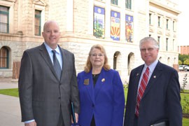 Glenn Hughes, left, Sen. Linda Gray, R-Phoenix, and Curtis Olafson, a Republican state senator from North Dakota, gather after a Senate committee endorsed a resolution that would have Arizona join other states asking Congress to call a convention to amend the U.S. Constitution to give states authority to limit the national debt.