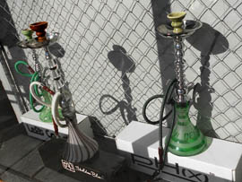 Hookah pipes are displayed in the window of a Phoenix smoke shop. State Rep. Kimberly Yee, R-Phoenix, has introduced legislation that would make it illegal to sell any device or paraphernalia used to smoke tobacco, including hookah pipes or water pipes, to those under 18.