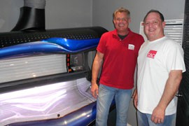 Tan United co-owners Keith Lipman, left, and Randy Eddlemon pose in front of a tanning bed. They don't see many teen customers because their business is located outside of high school areas in downtown Phoenix. They say that exposure to ultraviolet rays can be beneficial when done properly.