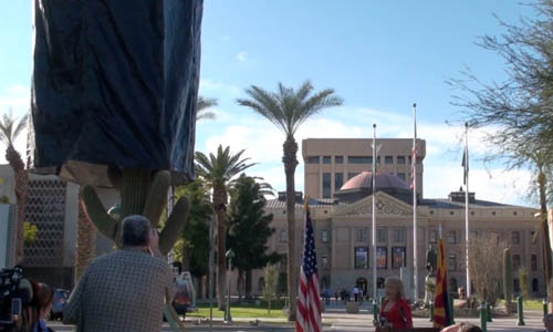 Gov. Jan Brewer unveils a transplanted saguaro at Wesley Bolin Memorial Plaza in Phoenix.