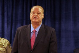 Arizona Attorney General Tom Horne, shown in this file photo from an October news conference, is expected to add Arizona to the list of states joining a $25 billion settlement against banks over their mortgage lending practices, officials said.