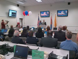 People gathered for the ribbon cutting of the new Arizona Division of Emergency Management backup emergency response center at Arizona State University's Polytechnic campus in Mesa, Ariz.