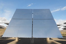 Mirror panels reflect sunlight towards the tower to turn the turbine within the head of the solar tower.