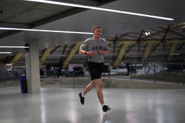 Freshman cadet Nolan Kirk runs laps at NAU's indoor track. He completed a two-mile run in under 14 minutes.