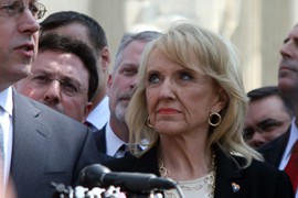 Gov. Jan Brewer, shown in a 2012 file photo, blasted the court decision blocking Arizona's driver's license policy as an 