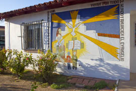 A mural painted on the main office building of Casa San Juan in Tucson.