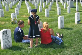 An unidentified family visits a soldier's grave at Arlington National Cemetery in Virginia this week, in advance of Memorial Day.