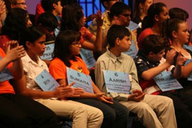 Sumaita Mulk, 13, of Goodyear, and Aarish Raza, 13, of Chinle, look on during the second round of the Scripps National Spelling Bee competition in the Washington, D.C., area.