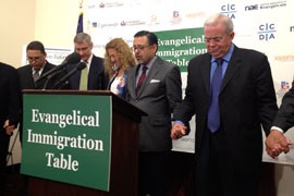 Members of the Evangelical Immigration Table join in prayer after the news conference where they called for bipartisan, comprehensive immigration reform based on Christian values.