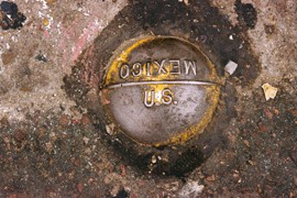 This medallion in the ground marks the border between the United States and Mexico.