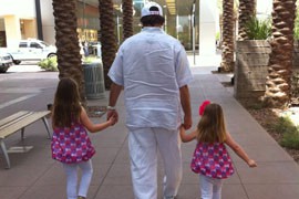 Scottsdale resident Sean Alfonso walks his two daughters on Easter Sunday 2012. He is one of a growing number of single dads involved in raising their children.