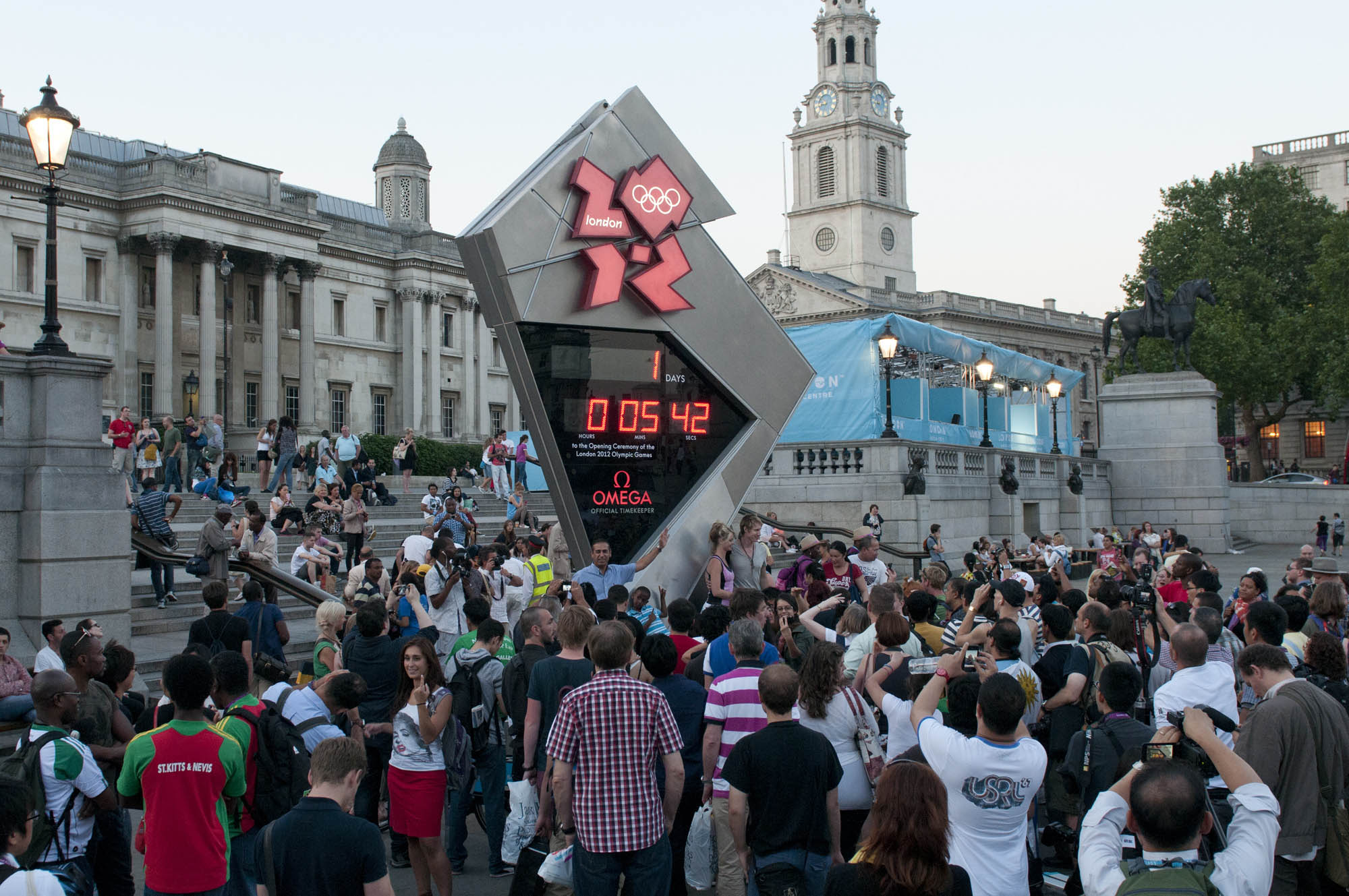 London residents and tourists gather around the Olympic Countdown Clock in London's Trafalgar Square to begin a countdown to 24 hours until the opening ceremony of the 2012 summer games.