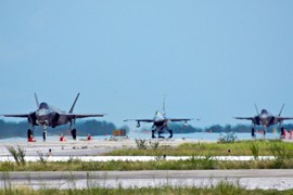 Two F-35s, left and right, taxi with an F-16 at Eglin Air Force Base in Florida last year. The Air Force announced that three squadrons of the next-generation jet produced by Lockheed Martin will be based in Luke Air Force Base in Glendale.