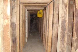 A yellow industrial floor fan mounted to the wall helps ventilate a sophisticated Yuma County drug-smuggling tunnel uncovered by authorities in July.