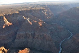 The characteristic milky blue of the Little Colorado River where it meets the darker waters of the Colorado in the Grand Canyon. The Little Colorado River is the largest tributary of the Colorado.