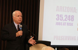 U.S. Sen. John McCain explains his concerns about potential defense cuts and their impact on Arizona's economy during a meeting Thursday with West Valley leaders in Peoria.