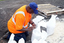 Tampa Bay Department of Solid Waste workers packed sandbags Sunday in preparation tropical storm Isaac.