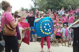 A woman dressed as a contraceptive packet warms up the crowd at a rally for women's rights. It was one of many protests, all of which have been kept at a distance from the convention itself.
