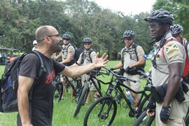 A protester confront police officers who stood at the edges of the Women are Watching rally in Tampa, Fla. Wednesday afternoon not far from the GOP convention.