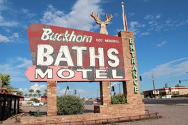 The Buckhorn Baths Motel sign as it looked in August 2012 on the corner of Main Street and Recker Road in Mesa, Arizona.