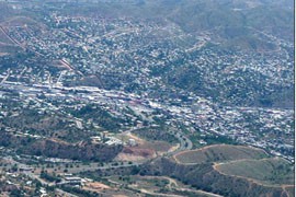 The U.S.-Mexico border fence, running from upper left to lower right in this 2004 aerial photograph, divides Nogales, Ariz., on the left and Nogales, Sonora, on the right.