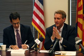 (Left) Glenn Hamer of the Arizona Chamber of Commerce and Industry and (right) U.S. Rep. Jeff Flake lead a meeting with local business leaders Wednesday at the Arizona Chamber of Commerce's office in Phoenix.