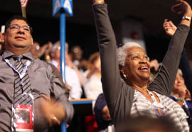 Arizona delegates Delores Adams (right) and Frank Bernal cheer Gabrielle Giffords' appearance at the Democratic National Convention.