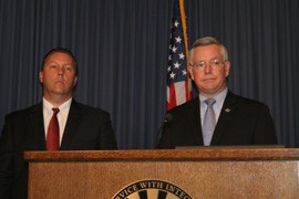 James Turgal, special agent in charge of the FBI's Phoenix Division, and Bill Montgomery, Maricopa County Attorney, answer questions from the media at a press conference Monday.