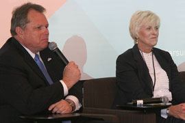 Mesa Mayor Scott Smith, left, discusses his city's goals and challenges in terms of sustainability during a panel discussion with other mayors Wednesday during the Arizona Solar Summit in Scottsdale. Goodyear Mayor Georgia Lord is at right.