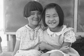 Ayako Nakamura, 9, and June Ibe, 6, in this 1942 photogragh, were among the more than 19,000 Japanese Americans who were forced to live in the camp at Poston between 1942 and 1945.