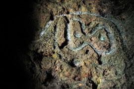 Hidden in a series of caves on the western shoreline of Puerto Rico, historic carvings like this one, mark the existence of the indigenous Taino Indians.
