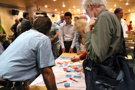 Participants in an Arizona Department of Transportation public meeting on the proposed Interstate 11 linking Phoenix and Las Vegas add ideas to a map of the draft alignment. The meeting is part of a two-year, $2.5 million study by transportation officials in Arizona and Nevada.