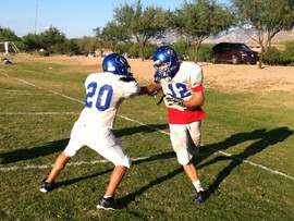 Members of Pusch Ridge Christian Academy's football team practice in Oro Valley recently.