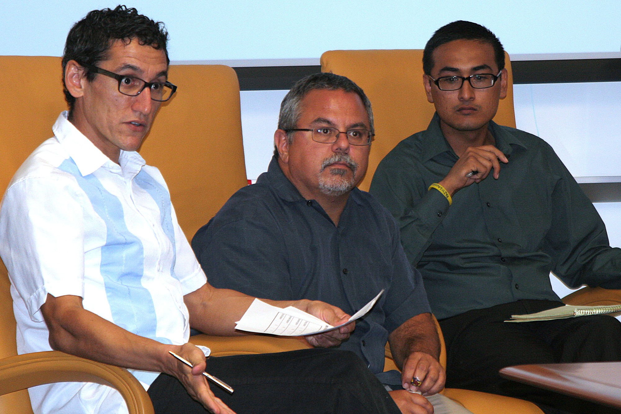 (From left) Rodolfo Espino, an associate professor in Arizona State University's School of Politics and Global Studies, Gary Segura, professor of American politics and Chair of Chicano/a-Latino/a Studies at Stanford University, and Daniel Rodriguez, a founder of the Arizona Dream Act Coalition, speak at a news conference analyzing results of a poll of Latino voters. Segura is a principal with the firm that conducted the poll.