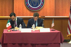 FCC Chairman Julius Genachowski, right, joins Hector Olavarria Tapia, Mexico’s undersecretary of communications, signing an agreement Tuesday to fight the theft and cross-border trafficking of cellular devices.