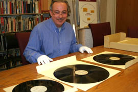 Robert Spindler, archivist and curator for the Arizona Collection at ASU Libraries, displays some recordings former Arizona Gov. Howard Pyle made as a radio broadcaster. In time for Veterans Day, ASU has made available online many of the messages home Pyle recorded for Arizonans serving in World War II.