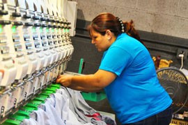 Super Embroidery and Screenprinting owner Anna Johnson said it takes up to six months to train workers for her business, which is why she can't afford to take chances on accidentally hiring an undocumented worker.