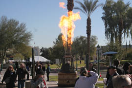 Lawmakers attendees mingled around a hot air balloon basket and other exhibits at Arizona Aviation Day.