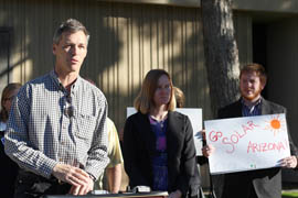 Randy Dunton (left) of Hawkins Design Group speaks at a rally Wednesday  in front of the Arizona Corporation Commission. Environmentalists and solar industry leaders spoke out against cuts to renewable energy incentives and said they fear even more cuts.