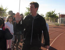 Phoenix Mayor Greg Stanton high-fives students after running at an event promoting FitPHX, an initiative encouraging Phoenix residents to exercise.