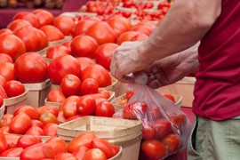 U.S. and Mexican governments unveiled a trade deal that will raise prices on Mexican tomatoes sold here, stopping a U.S. investigation into charges that Mexicans were selling produce here below prices. The deal may have headed off a trade war, but will likely mean higher costs for consumers.