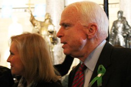 Sen. John McCain, R-Ariz., walks through the Capitol on his way to the State of the Union. A previous proposal from McCain on climate change was cited by President Barack Obama as the sort of market-driven, bipartisan proposal that is needed in Congress.