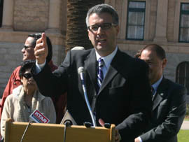 Randy Parraz with Citizens for a Better Arizona speaks Tuesday at a news conference criticizing three GOP bills on elections. He noted that last year his group collected over 4,000 ballots, many of them from Latino voters, and turned them in at polling places, something that would be a felony under SB 1003.