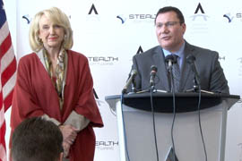 Gov. Jan Brewer joins Gerard Warrens, CEO of Stealth Software, at a news conference Tuesday announcing the Dutch company's plans to place its U.S. headquarters in the Valley.