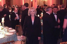 Gov. Jan Brewer posted this picture on her Facebook page, showing her at Sunday's White House dinner with other governors. But don't expect her and President Barack Obama to friend each other as a result.