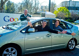 From left: Google Executive Chairman Eric Schmidt, CEO Larry Page and co-founder Sergey Brin pose in a self-driving car the company is developing.
