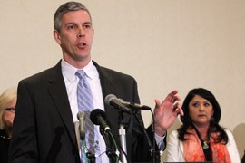 U.S. Education Secretary Arne Duncan met with school officials whose districts rely heavily on federal funding, like Window Rock Unified School District Superintendent Debbie Jackson-Dennison, right. Duncan said the automatic budget cuts known as 